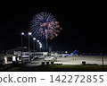 An airplane standing in the August night sky. 142272855