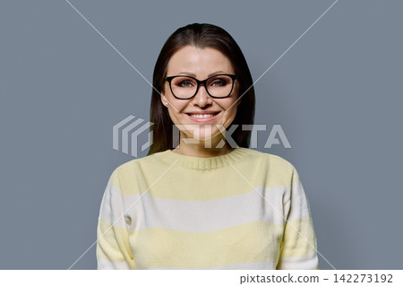 Close up portrait of confident 40s mature woman in glasses studio shot Close up portrait of confident 40s mature woman in glasses studio shot 142273192