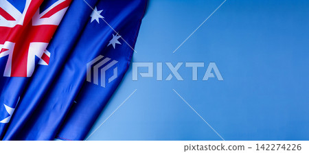 National symbol of Australia flag background. Copy space for your text. Concept of National day National symbol of Australia flag background. Copy space for your text. Concept of National day 142274226