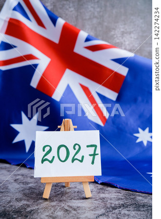 Australian flag and text 2027 trendy template for upcoming year campaigns. Patriotic design marking 2027 beside national flag. Concept of future vision and planning ideal for annual report or goal Australian flag and text 2027 trendy template for upcoming year campaigns. Patriotic design marking 2027 beside national flag. Concept of future vision and planning ideal for annual report or goal 142274234