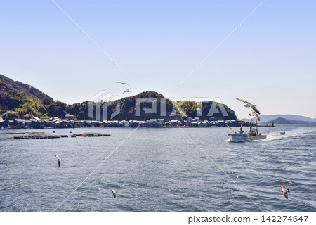 View of the boathouses from a sightseeing boat on the Ine Bay. 142274647