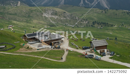 Alpine hut in alpe di siusi dolomites mountains enjoying nature Alpine hut in alpe di siusi dolomites mountains enjoying nature 142275092