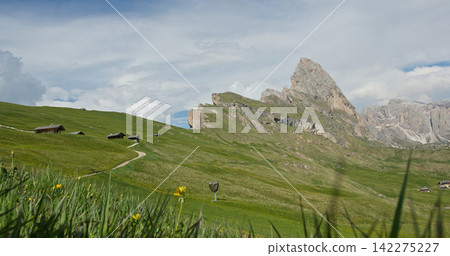 Seceda mountain landscape with alpine huts and meadow Seceda mountain landscape with alpine huts and meadow 142275227