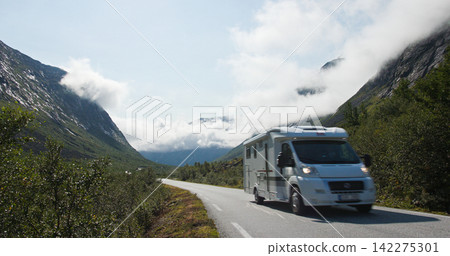 Camper van traveling mountain road in norway Camper van traveling mountain road in norway 142275301