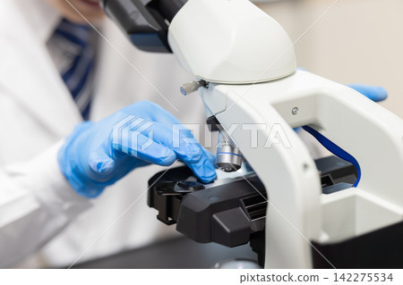 Research Image: A man's hands working in a research lab. Photography cooperation: Denpa Gakuen Tokyo Electronics College. Research Image: A man's hands working in a research lab. Photography cooperation: Denpa Gakuen Tokyo Electronics College. 142275534