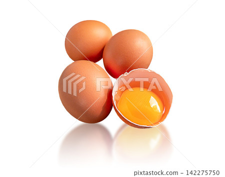 Three whole brown chicken eggs and one cracked eggshell with raw golden yolk isolated on white background. Cooking ingredients for cooking, baking, breakfast, nutrition and healthy homemade meals use. 142275750