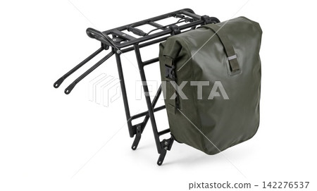 Black metal bicycle cargo rack with a waterproof green pannier bag waterproof aluminum transportation isolated background accessory equipment adventure recreation structure component 142276537