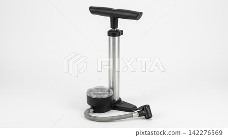 Modern standing floor tire pump with pressure gauge and black handle on white background pressure pneumatic inflation accessory equipment maintenance automotive functional hardware mechanism Modern standing floor tire pump with pressure gauge and black handle on white background pressure pneumatic inflation accessory equipment maintenance automotive functional hardware mechanism 142276569