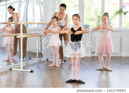 Group of girls standing in first position Group of girls standing in first position 142279983