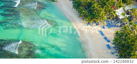 Aerial view of an wonderful caribbean beach and luxury resort in La Romana Aerial view of an wonderful caribbean beach and luxury resort in La Romana 142280032