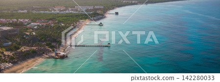 Lighthouse on the beach of the turquoise Caribbean sea at sunset Lighthouse on the beach of the turquoise Caribbean sea at sunset 142280033