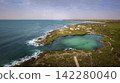 Panorama of beach with a stunning cliff overlooking the Caribbean Sea 142280040