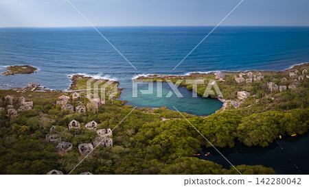 Aerial view of beach with a stunning cliff overlooking the Caribbean Sea Aerial view of beach with a stunning cliff overlooking the Caribbean Sea 142280042
