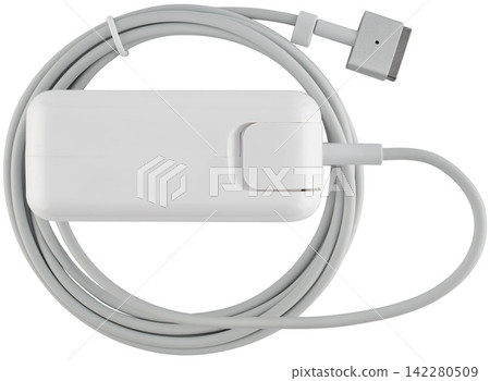 White glossy power adapter for laptops with coiled cable close-up view. White glossy power adapter for laptops with coiled cable close-up view. 142280509