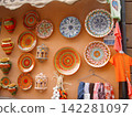 Painted plates from open-air stalls in Granada, Spain 142281097
