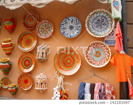 Painted plates from open-air stalls in Granada, Spain Painted plates from open-air stalls in Granada, Spain 142281097