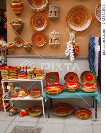 Painted plates from open-air stalls in Granada, Spain Painted plates from open-air stalls in Granada, Spain 142281098