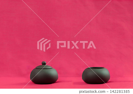 Breast cancer awareness concept with ceramic containers on pink background for women health campaign Breast cancer awareness concept with ceramic containers on pink background for women health campaign 142281385