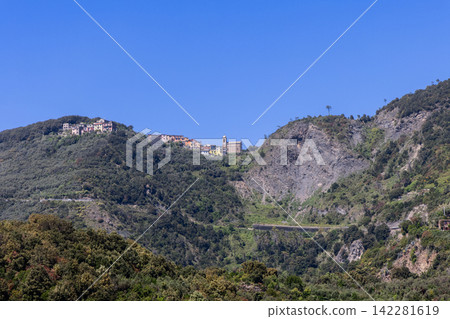 Cinque Terre in northwest Italy by the Ligurian Sea from long telephoto inland perspective Cinque Terre in northwest Italy by the Ligurian Sea from long telephoto inland perspective 142281619