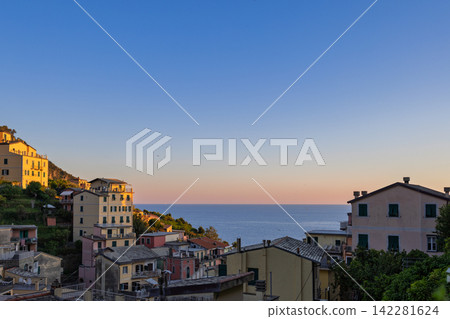 Riomaggiore in Liguria, Italy from elevated village perspective toward the horizon Riomaggiore in Liguria, Italy from elevated village perspective toward the horizon 142281624