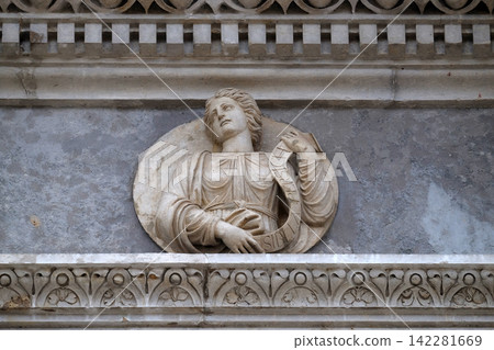 Persian Sibyl, relief on the portal of the Cathedral of Saint Lawrence in Lugano, Switzerland Persian Sibyl, relief on the portal of the Cathedral of Saint Lawrence in Lugano, Switzerland 142281669