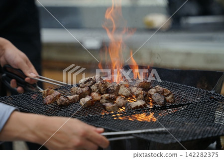 Barbecue Meat Over Open Flame Barbecue Meat Over Open Flame 142282375