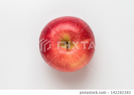 A single New Zealand Crips Pink apple photographed from directly above against a white background. A single New Zealand Crips Pink apple photographed from directly above against a white background. 142282383