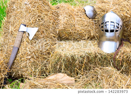 middle age armor and weapon ax hatchet helmet iron equipment of the knight middle age armor and weapon ax hatchet helmet iron equipment of the knight 142283973
