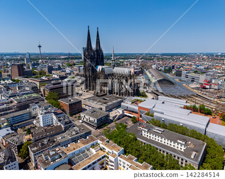 High angle wide horizontal aerial drone photograph of Cologne Cathedral, Central Station, Museum Ludwig, Colonius TV tower, and city skyline in Cologne, North Rhine-Westphalia, Germany, Central Europe High angle wide horizontal aerial drone photograph of Cologne Cathedral, Central Station, Museum Ludwig, Colonius TV tower, and city skyline in Cologne, North Rhine-Westphalia, Germany, Central Europe 142284514