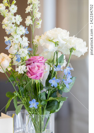 A flower arrangement in soft colors. A flower arrangement in soft colors. 142284702