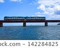 A train running over the blue sea 142284825