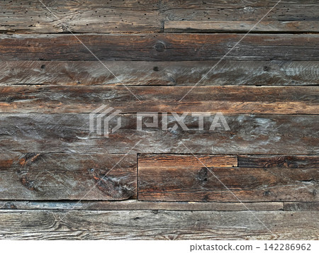 Weathered wood texture from an old wooden house Weathered wood texture from an old wooden house 142286962