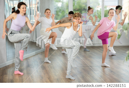 Group of boys and girls dancing dancehall Group of boys and girls dancing dancehall 142288151