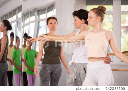 Teenage boy and girl rehearsing paired ballet Teenage boy and girl rehearsing paired ballet 142288500