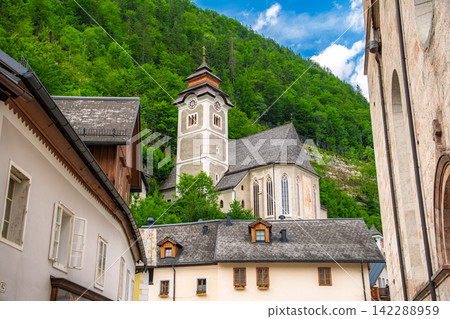 Hallstatt, Austria. Maria am Berg Church and the lush green Alps. Hallstatt, Austria. Maria am Berg Church and the lush green Alps. 142288959