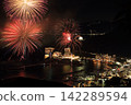 Splendid fireworks blooming on the sea 142289594