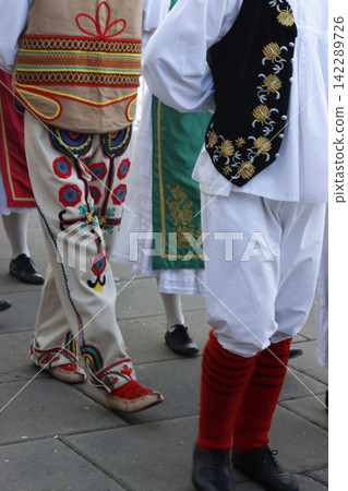 People wearing the traditional Serbian clothes People wearing the traditional Serbian clothes 142289726