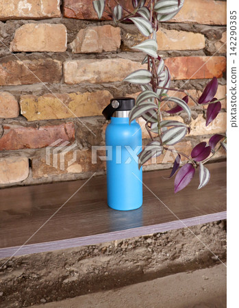 vintage water bottle on wooden wall vintage water bottle on wooden wall 142290385