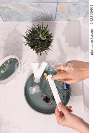 Fragrance Testing at a Minimalist Vanity: Perfume Bottle, Blotter Strips on Marble Tray Fragrance Testing at a Minimalist Vanity: Perfume Bottle, Blotter Strips on Marble Tray 142290401