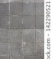 Architectural texture material consisting of uniformly arranged gray square tiles. 142290521