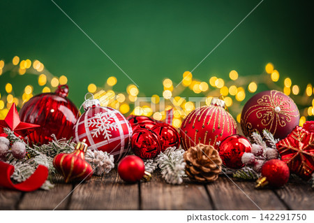 Red Christmas Ornaments with Star and Pinecone on Rustic Wood Red Christmas Ornaments with Star and Pinecone on Rustic Wood 142291750
