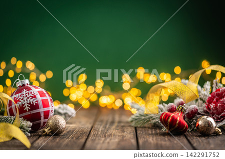 Red Plaid Christmas Ornament with Gold Ribbon on Rustic Wood Red Plaid Christmas Ornament with Gold Ribbon on Rustic Wood 142291752