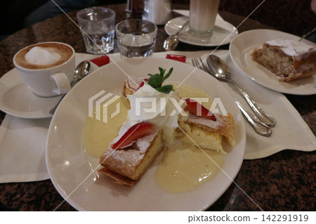 Viennese Strudel Desserts Served with Cappuccino and Vanilla Sauce Viennese Strudel Desserts Served with Cappuccino and Vanilla Sauce 142291919