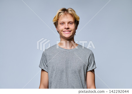 Portrait of smiling teenage boy looking at camera Portrait of smiling teenage boy looking at camera 142292044