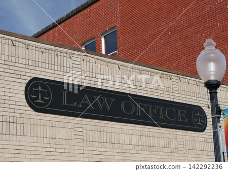 Law Office Sign on Small Downtown Building in Rural Small Town Law Office Sign on Small Downtown Building in Rural Small Town 142292236