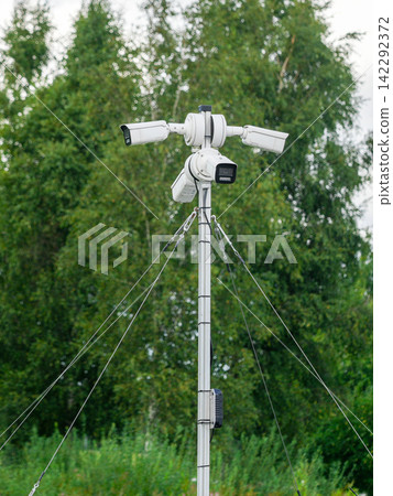 Multiple Outdoor Security Cameras Mounted on Pole for Professional Video Surveillance and Monitoring Multiple Outdoor Security Cameras Mounted on Pole for Professional Video Surveillance and Monitoring 142292372