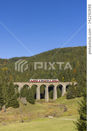 Modern diesel train, railway bridge Chramossky viadukt near Telgart, Horehronie, Slovakia Modern diesel train, railway bridge Chramossky viadukt near Telgart, Horehronie, Slovakia 142292698