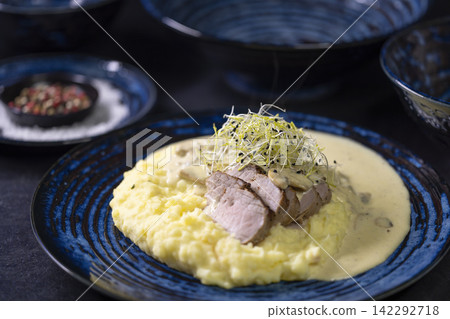 Pork tenderloin with mushroom sauce and mashed potatoes Pork tenderloin with mushroom sauce and mashed potatoes 142292718