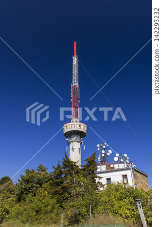 Telecommunication tower reaching for the blue sky Telecommunication tower reaching for the blue sky 142293232