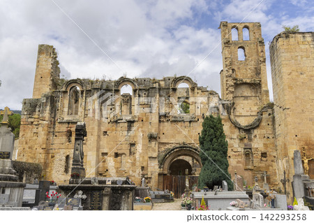 Ruins of the Abbey of Sainte Marie in Alet les Bains, showing remaining walls and arches under blue sky Ruins of the Abbey of Sainte Marie in Alet les Bains, showing remaining walls and arches under blue sky 142293258